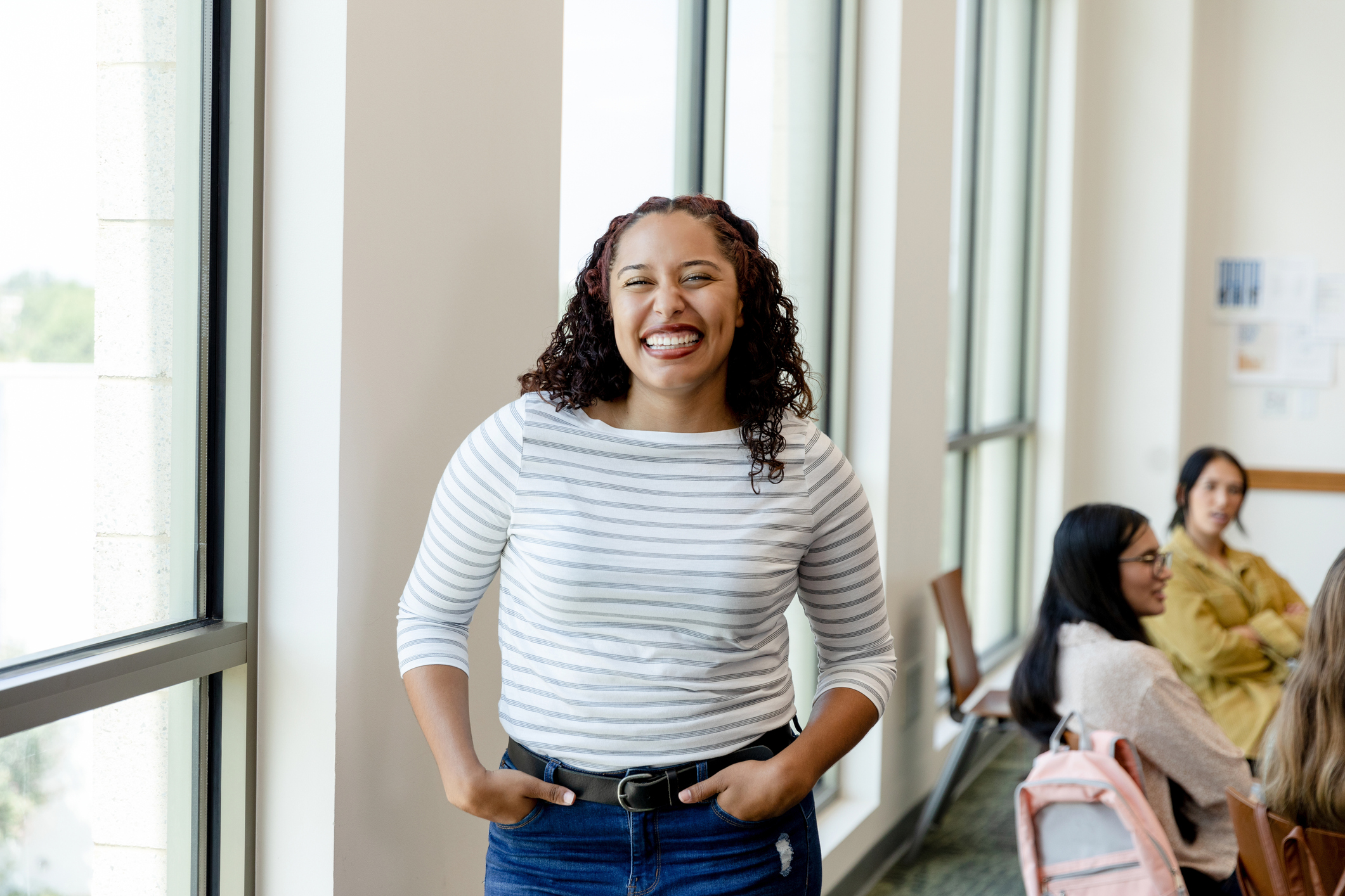 A young woman is smiling